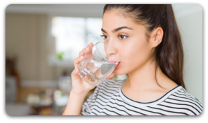 Drinking plenty of water can help reduce oil from the skin